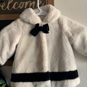 First impression off white and black coat